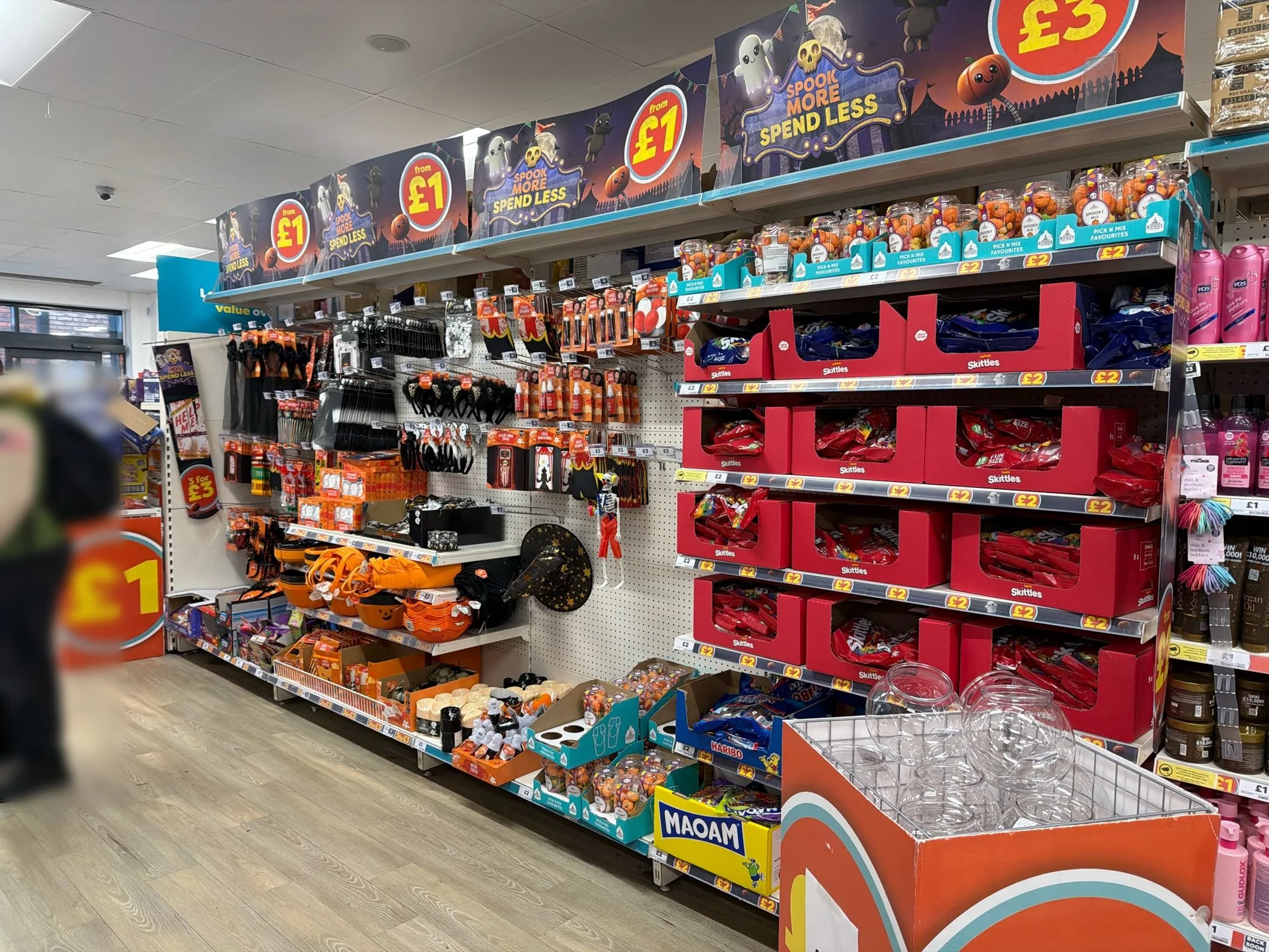 Halloween display in a UK discount store, with sweets and Halloween accessories